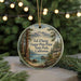 A round ornament featuring a scenic landscape with a lake, mountains, and pine trees, with the text "Ed Zberg Sugar Pine Point State Park, California" displayed prominently.