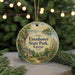 A round ornament with a scenic landscape of Eisenhower State Park, Kansas, featuring a house, trees, and a body of water.