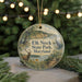 A round ornament with a scenic image of a deer, a bird, and a path in front of a body of water, with the text "Elk Neck State Park, Maryland" displayed on it.