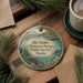 A round ornament with a picture of a bird and a bear, along with text that says "Ellie Schiller Homosassa Springs Wildlife State Park, Florida".