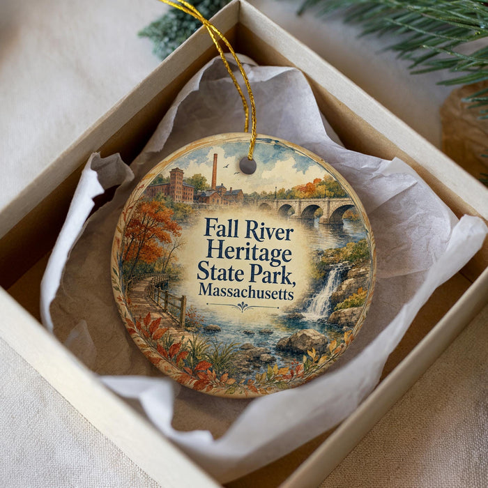 A decorative ornament in a box, featuring a scenic image of Fall River Heritage State Park in Massachusetts.
