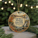 A circular ornament with a scenic image of Fall River Heritage State Park in Massachusetts, featuring a bridge, waterfall, and autumn foliage.
