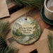 A round ornament with a scenic landscape of Ferne Clyffe State Park, Illinois, featuring a river, trees, and mountains.