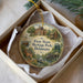 A decorative ornament in a white box, featuring illustrations of historic buildings and scenes from the First State Heritage Park in Delaware.