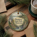 A decorative ornament featuring a scenic landscape of Flandrau State Park in Minnesota, with pine trees and a lake in the background.
