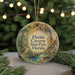 A circular ornament with a scenic illustration of the Florida Caves State Park, featuring a winding path, a river, and a forest landscape.