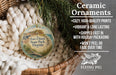 Ceramic ornaments, featuring a round ornament with a design of Fort Clinch State Park, Florida, hanging from a wicker basket.