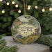 A round ornament with a painting of Fort Defiance State Park, Iowa, featuring a river, a castle, and a bridge.
