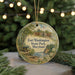 A round ornament with a painting of Fort Washington State Park, Maryland, hanging from a string.