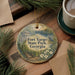 A decorative ornament with a scenic image of Fort Yargo State Park, Georgia, surrounded by pine branches and a cup of coffee on a wooden surface.