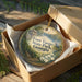 A decorative ornament in a wooden box, featuring a scenic image of Fort Yargo State Park, Georgia.