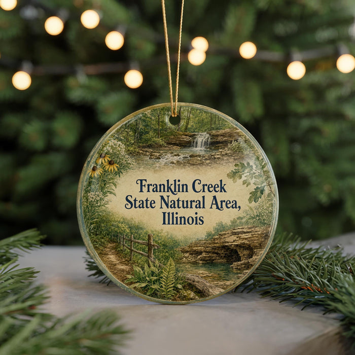 A round ornament with a scenic image of Franklin Creek, the State Natural Area in Illinois, surrounded by greenery and a waterfall.
