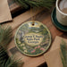A round ornament with a scenic landscape of George T. Bagby State Park, Georgia, featuring a waterfall, pine trees, and flowers.