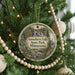 A circular ornament hanging on a Christmas tree, featuring a scenic image of Gooseberry Falls State Park in Minnesota.