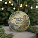 A circular ornament with a scenic landscape of the Great River Bluffs State Park in Minnesota, featuring a mountain, river, and pine trees.