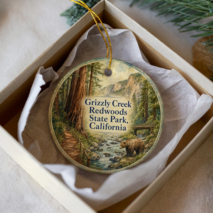 A round ornament with a scenic image of Grizzly Creek, Redwoods State Park, California, hanging from a string.