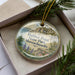 A decorative ornament in a box, featuring a scenic image of Halibut Point State Park in Massachusetts.