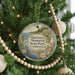 A round ornament hanging on a Christmas tree, featuring a scenic image of Harkness Memorial State Park, Connecticut.