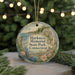 A round ornament with a scenic image of Harkness Memorial State Park, Connecticut, hanging from a string.