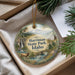 A decorative ornament with a scenic landscape of Harriman State Park, Idaho, featuring a waterfall, pine trees, and a deer.