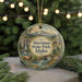 A round ornament with a scenic landscape of Harriman State Park, Idaho, featuring a waterfall, pine trees, and a deer.