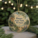 A round ornament with a scenic landscape of a forest and a lake, featuring the text "HAYES STATE PARK, MICHIGAN" on it, is displayed in front of a blurred background with Christmas lights.