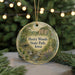 A round ornament with a scenic landscape of Heery Woods State Park, Iowa, featuring a river, trees, and a bridge.
