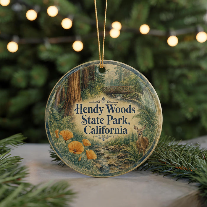 A round ornament with a scenic image of Hendy Woods State Park, California, featuring a deer and a stream.