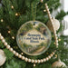 A round ornament hanging on a Christmas tree, featuring a scenic image of Hennepin Canal State Park, Illinois.