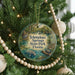 A Christmas tree ornament with the text "Ictetusnnee Springs State Park, Florida" on it, surrounded by a beaded garland and other ornaments.