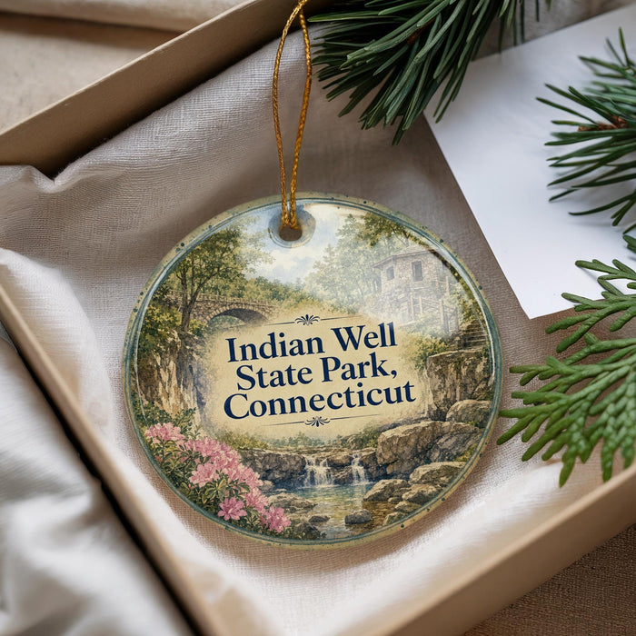 A decorative ornament with a scenic image of Indian Well State Park, Connecticut, hanging from a string.