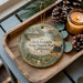 A wooden tray with a decorative ornament featuring a scenic landscape and the text "Jack London State Historic Park, California".