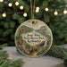 A round ornament with a scenic landscape of Jenny Wiley State Resort Park, Kentucky, featuring a bridge, trees, and a waterfall.