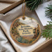 A round ornament with a picture of Jerome State Historic Park, Arizona, hanging from a string.