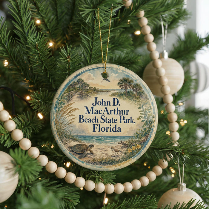 A round ornament hanging on a Christmas tree, featuring a scenic image of a beach and palm trees.