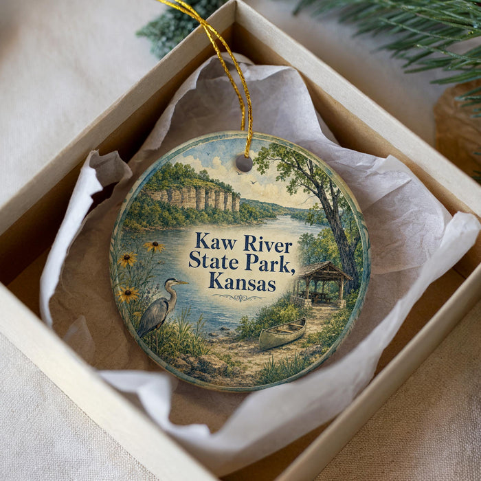A round ornament with a scenic image of Kaw River State Park, Kansas, hanging from a string.