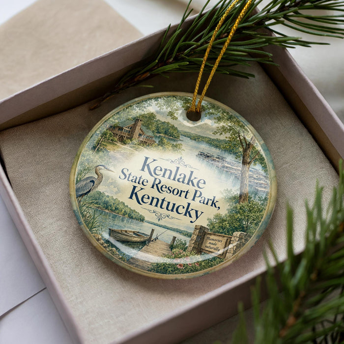 A decorative ornament in a box, featuring a scenic image of Kenlake State Resort Park, Kentucky.