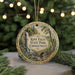 A round ornament with a scenic image of Kent Falls State Park, Connecticut, hanging from a string.