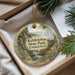 A decorative ornament with a scenic landscape of kettletown state park, Connecticut, hanging from a string.