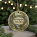 A round ornament with a scenic image of kettletown state park, Connecticut, hanging from a string.
