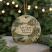 A round ornament with a scenic landscape of Lake Charles State Park, Arkansas, featuring a lake, a cabin, and a bird.