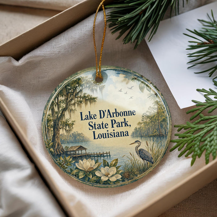 A decorative ornament with a scenic image of Lake D'Arbonne State Park in Louisiana, featuring a bird, trees, and a body of water.