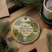 A decorative ornament with a scenic image of Lake of Three Fires State Park, Iowa, featuring a bird, a river, and a cabin.