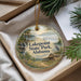 A round ornament with a scenic image of Lakepoint State Park, Alabama, hanging from a string.