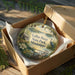 A decorative ornament in a box, featuring a scenic image of LeRoy Percy State Park in Mississippi.
