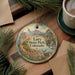 A round ornament with a scenic landscape of Lory State Park, Colorado, featuring a deer, mountains, and a river.