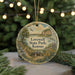 A round ornament with a scenic landscape of Lovewell State Park, Kansas, featuring a cabin, trees, and a lake.