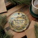 A decorative ornament with the text "MacKerracher State Park, California" is displayed on a wooden surface, surrounded by pine branches and a cup of coffee.