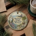 A decorative ornament featuring a scenic image of Mackinac Island, Michigan, with a bicycle and a horse-drawn carriage in the foreground.