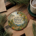 A decorative ornament featuring a scenic landscape of Maplewood State Park in Minnesota, with pine trees and a winding path.